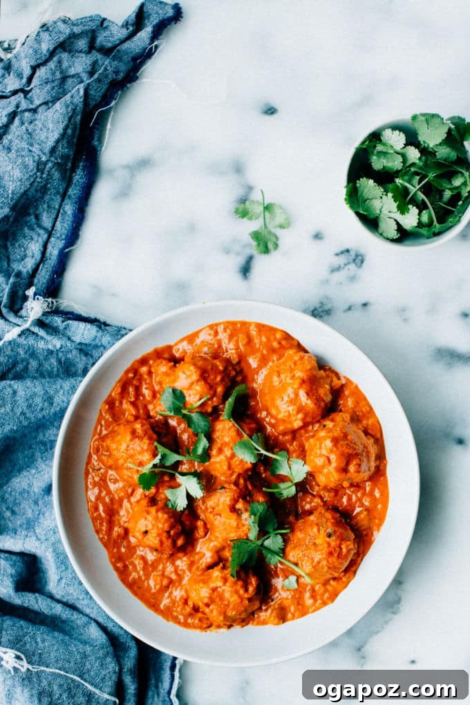 Effortless Creamy Paneer Kofta Curry 4 Malai Kofta in a bowl with fresh cilantro on top, ready to be served.