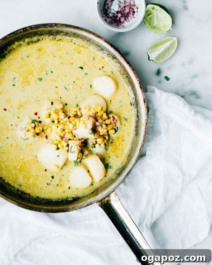 Golden Thai Scallops with Zesty Corn Relish 4 Overhead shot of Thai Coconut Scallops garnished with fresh corn relish, ready to be served.