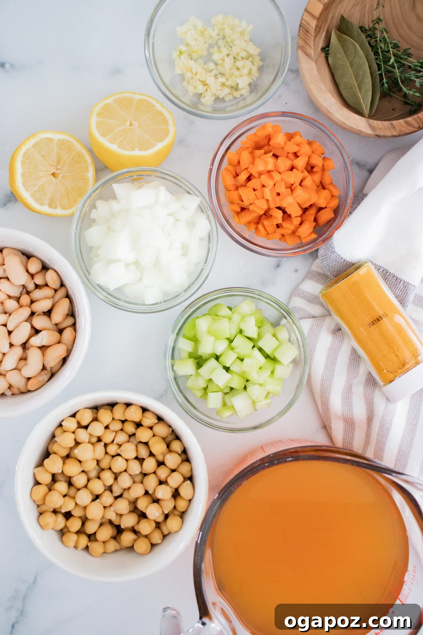 Effortless Vegetable Bean Soup 3 All the fresh ingredients laid out for Easy Vegetable Bean Soup, including carrots, celery, onion, garlic, spices, and canned beans.