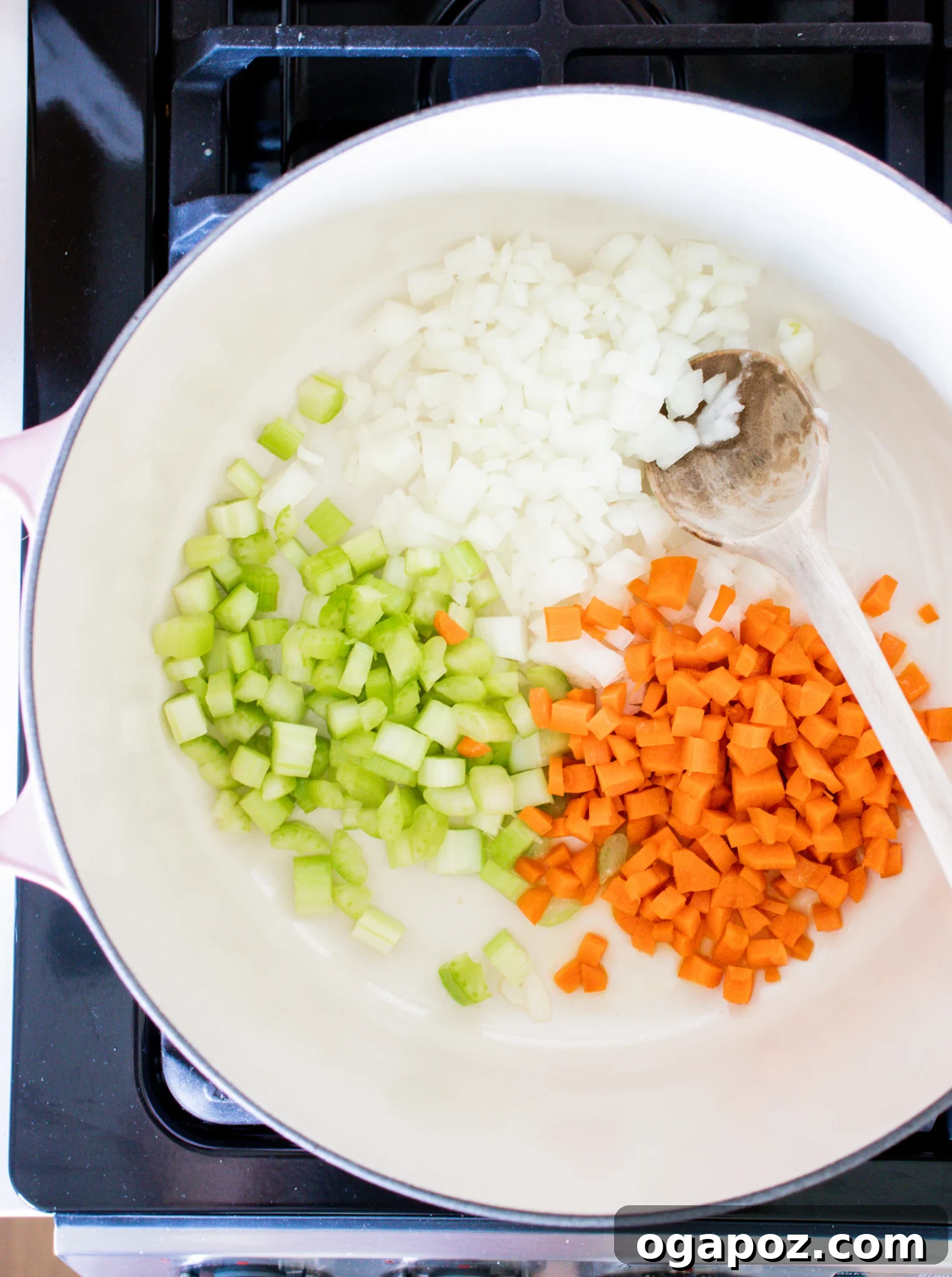 Effortless Vegetable Bean Soup 5 Diced carrots, celery, and onion sautéing in a Dutch oven, forming the aromatic base for the Easy Vegetable Bean Soup.