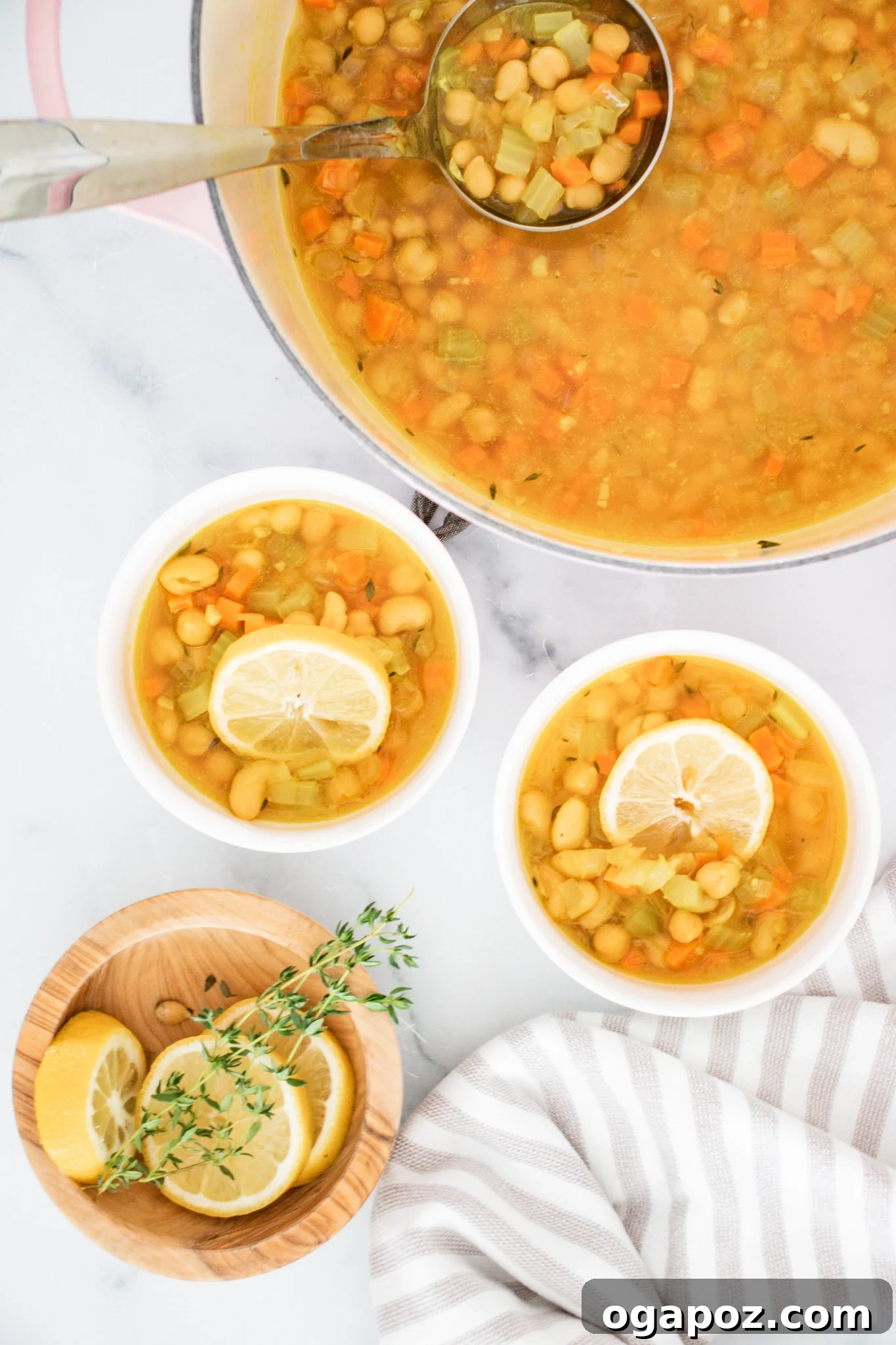 Effortless Vegetable Bean Soup 8 Multiple servings of Easy Vegetable Bean Soup in white bowls, beautifully presented with garnishes.