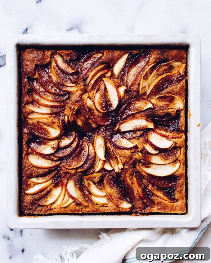 Spiced Apple Pie Cake 4 Apples layered beautifully on top of the cake batter before baking.