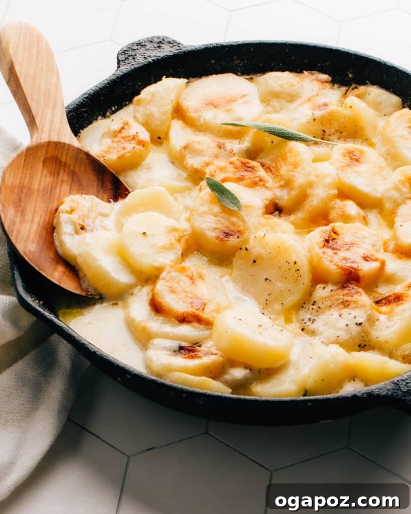 Elevate Your Wing Meal Side Dish Ideas 11 Hearty gluten-free potatoes au gratin in a cast iron pan, ready to be served.
