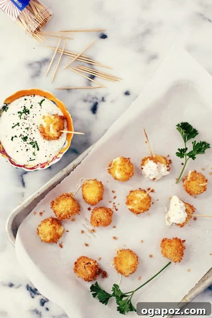 Elevate Your Wing Meal Side Dish Ideas 15 Homemade breaded Mini Mozzarella Sticks served with a creamy Jalapeño Ranch Dip.