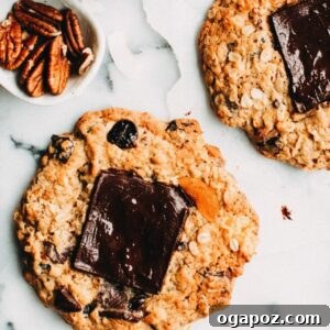 Close-up of a freshly baked Giant Kitchen Sink Cookie with perfectly melted dark chocolate on top