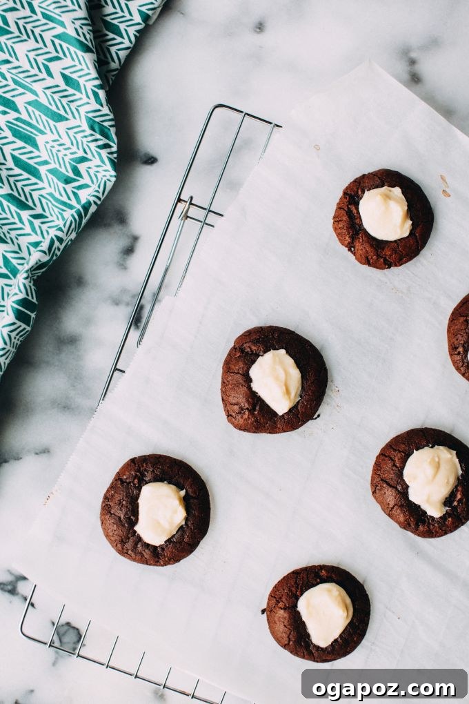 Rich Chocolate Cheesecake Cookies 2 Delicious chocolate cheesecake cookies on a cooling rack