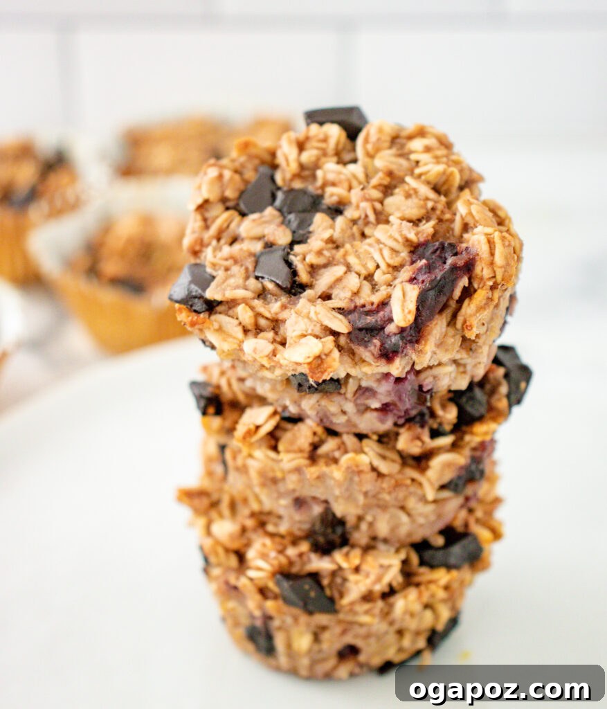 Golden Banana Oat Goodness 4 Stack of warm Banana Oatmeal Muffins, showcasing their fluffy texture and delicious additions