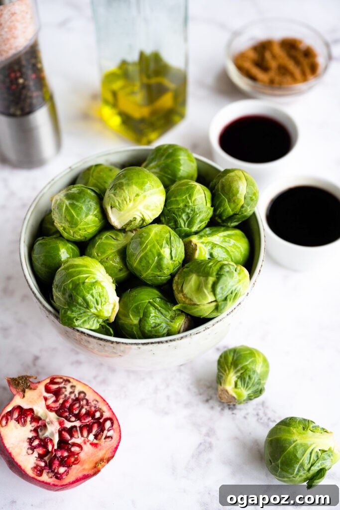Balsamic Glazed Brussels Sprouts 3 Fresh Brussels sprouts, olive oil, balsamic vinegar, pomegranate juice, and brown sugar laid out on a table as ingredients.