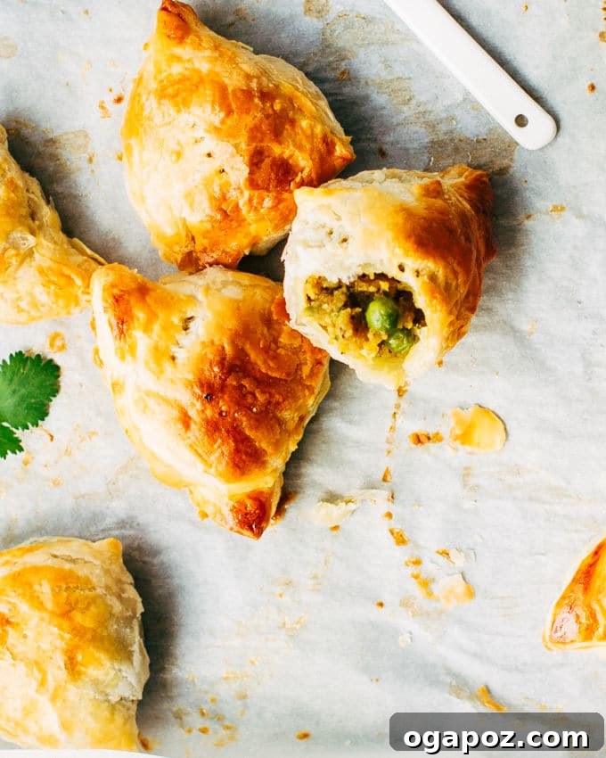 Effortless Flaky Samosas 11 A vibrant display of baked flaky shortcut samosas arranged on a platter, ready to be enjoyed as a delightful appetizer or snack.