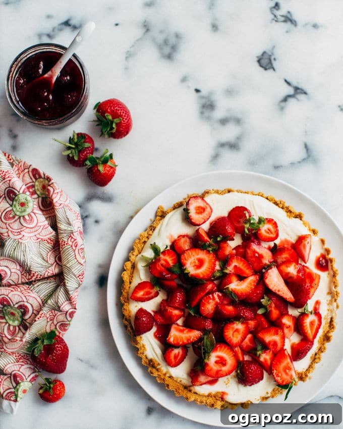 Silky Strawberry White Chocolate Cloud Tart 4 Finished White Chocolate Mousse Strawberry Tart with whole and halved strawberries, some with stems for presentation