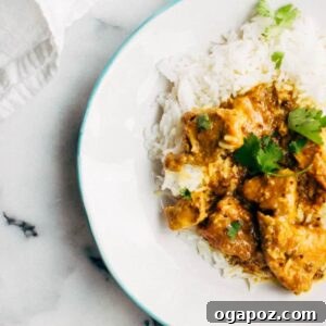 Vindaloo Pork Curry on a plate with rice.