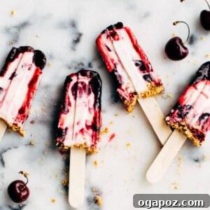 Beautiful Cherry Cheesecake Popsicle with visible layers and crunchy topping.