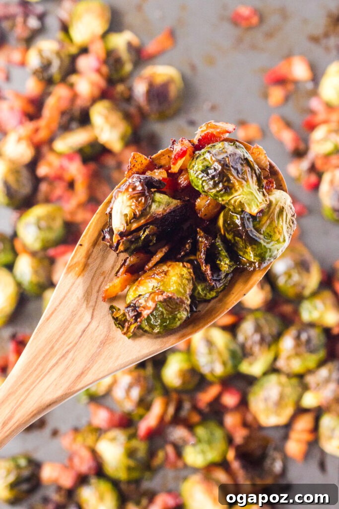 Roasted Brussels Sprouts and Bacon Delight 2 Crispy Roasted Brussels Sprouts with Bacon on a spoon