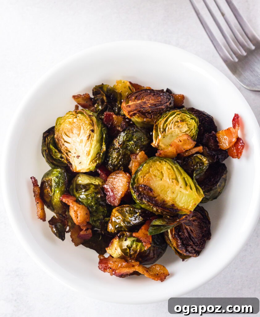 Roasted Brussels Sprouts and Bacon Delight 7 Roasted Brussels Sprouts with Bacon in a white bowl, ready to be enjoyed with a fork