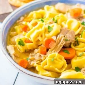Chicken Tortellini Soup in a blue bowl