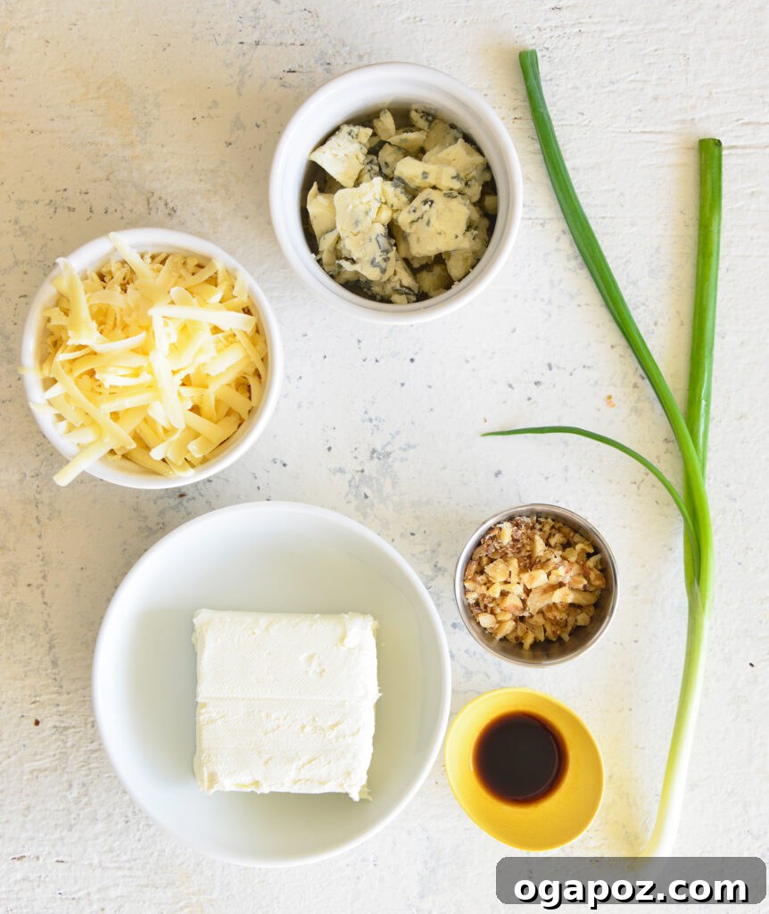 Your Guide to an Irresistible Cheese Ball 4 Ingredients for a classic cheese ball laid out on a kitchen counter, including cream cheese, cheddar, blue cheese, green onions, Worcestershire sauce, and walnuts.