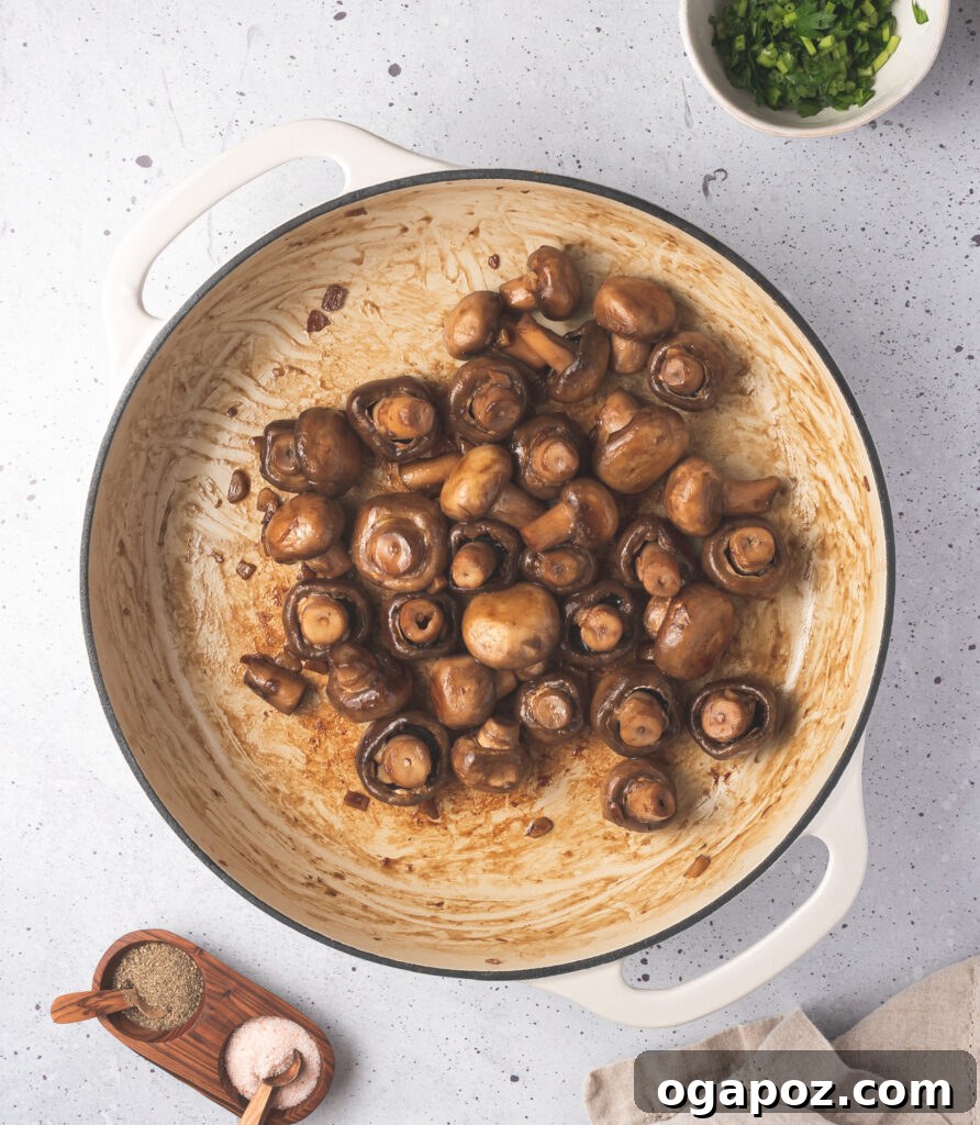 Savory Garlic Mushrooms 7 Garlic Sautéed Mushrooms in pot with oil