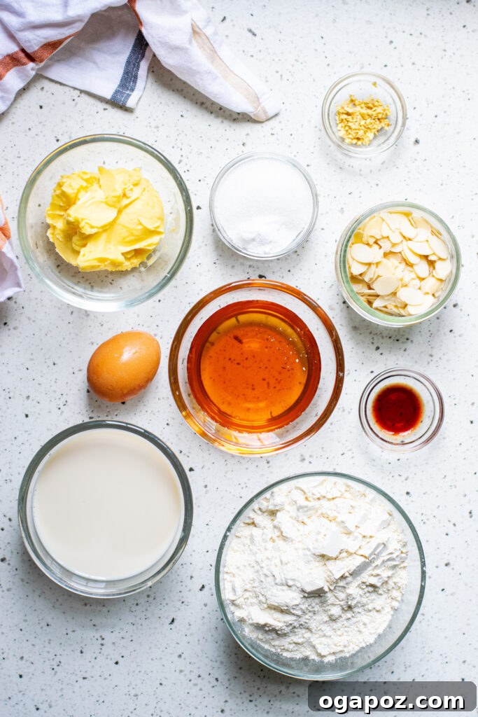 Heavenly Almond Cake 3 A collection of ingredients for the Almond Cake recipe, including flour, honey, almonds, and butter.