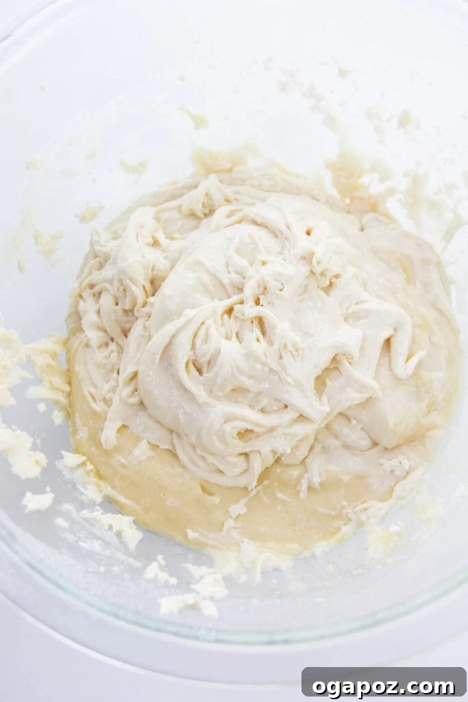 The Easiest Cake Mix Sugar Cookies 5 Easy Cake Mix Sugar Cookies dough being mixed in a bowl.