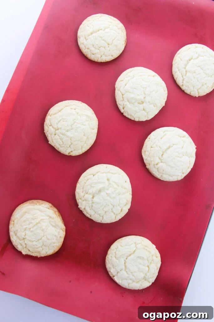 The Easiest Cake Mix Sugar Cookies 7 Easy Cake Mix Sugar Cookies freshly baked on a silicone mat.
