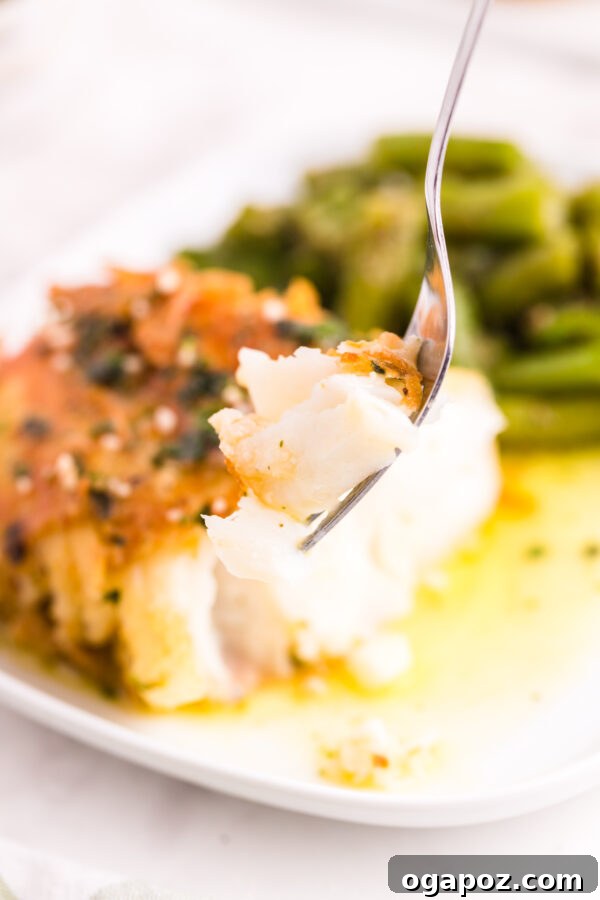 Golden Garlic Butter Seared Cod 4 Crispy pan-fried garlic butter cod cooking in a skillet, showcasing its golden-brown crust