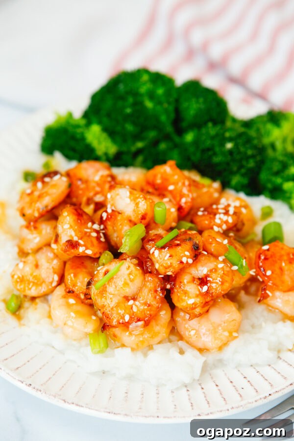 Sticky Sriracha Honey Garlic Shrimp 4 Honey Garlic Sriracha Shrimp served alongside vibrant green steamed broccoli