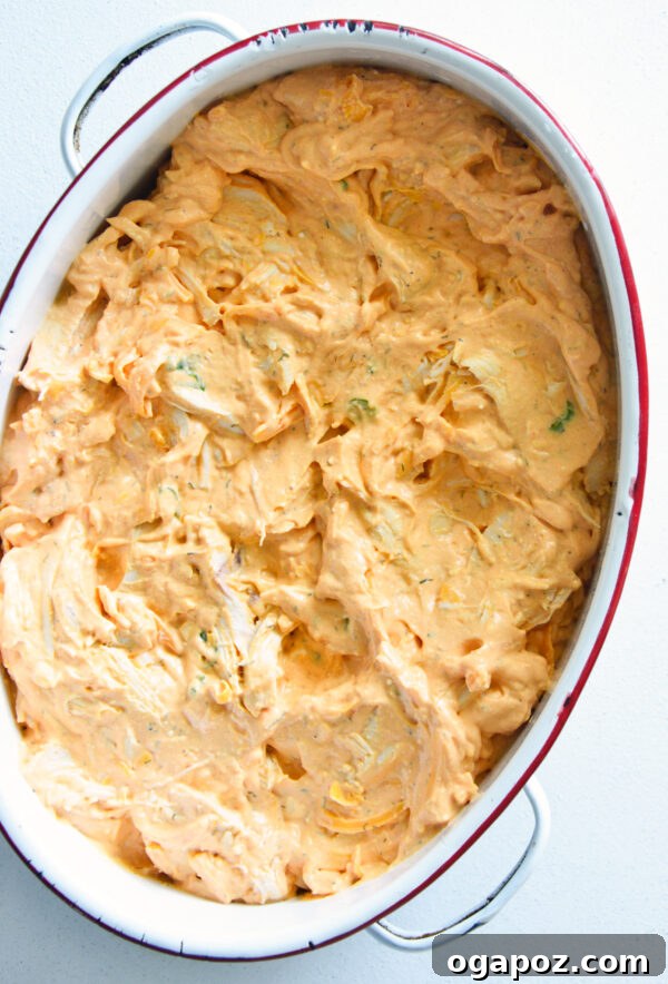 Ultimate Buffalo Chicken Dip Recipe 7 Buffalo Chicken Dip mixture spread into a baking dish