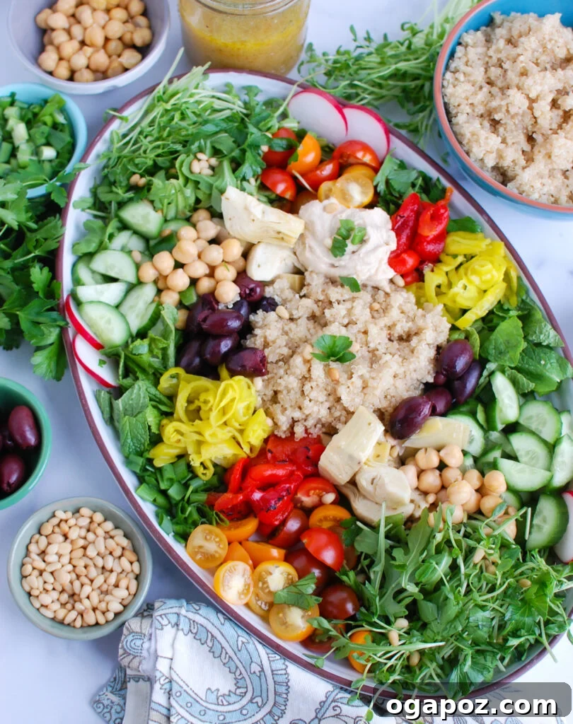 Zesty Greek Quinoa Nourish Bowl 6 Beautifully arranged Greek Quinoa Bowl ingredients on a serving platter