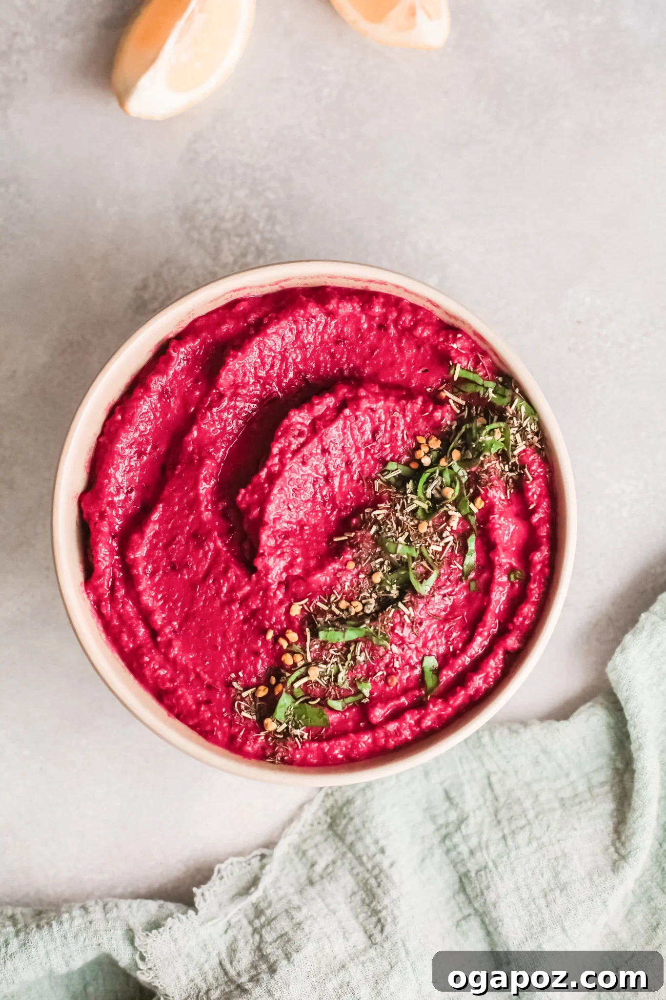 Vibrant Beetroot Hummus 4 Easy Beet Hummus garnished with fresh herbs and a drizzle of olive oil