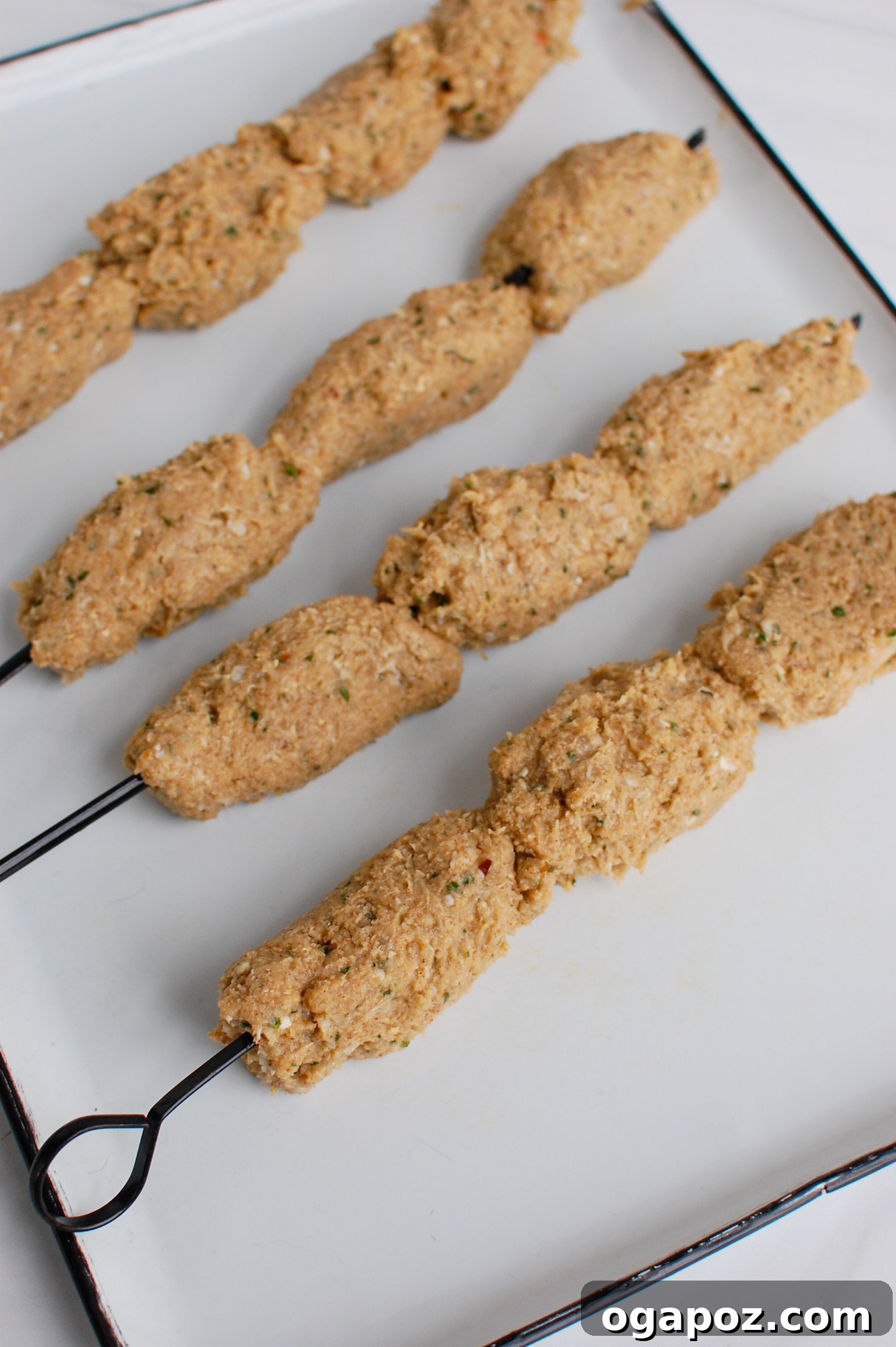 Beautifully grilled Chicken Kofta skewers arranged on a serving plate.