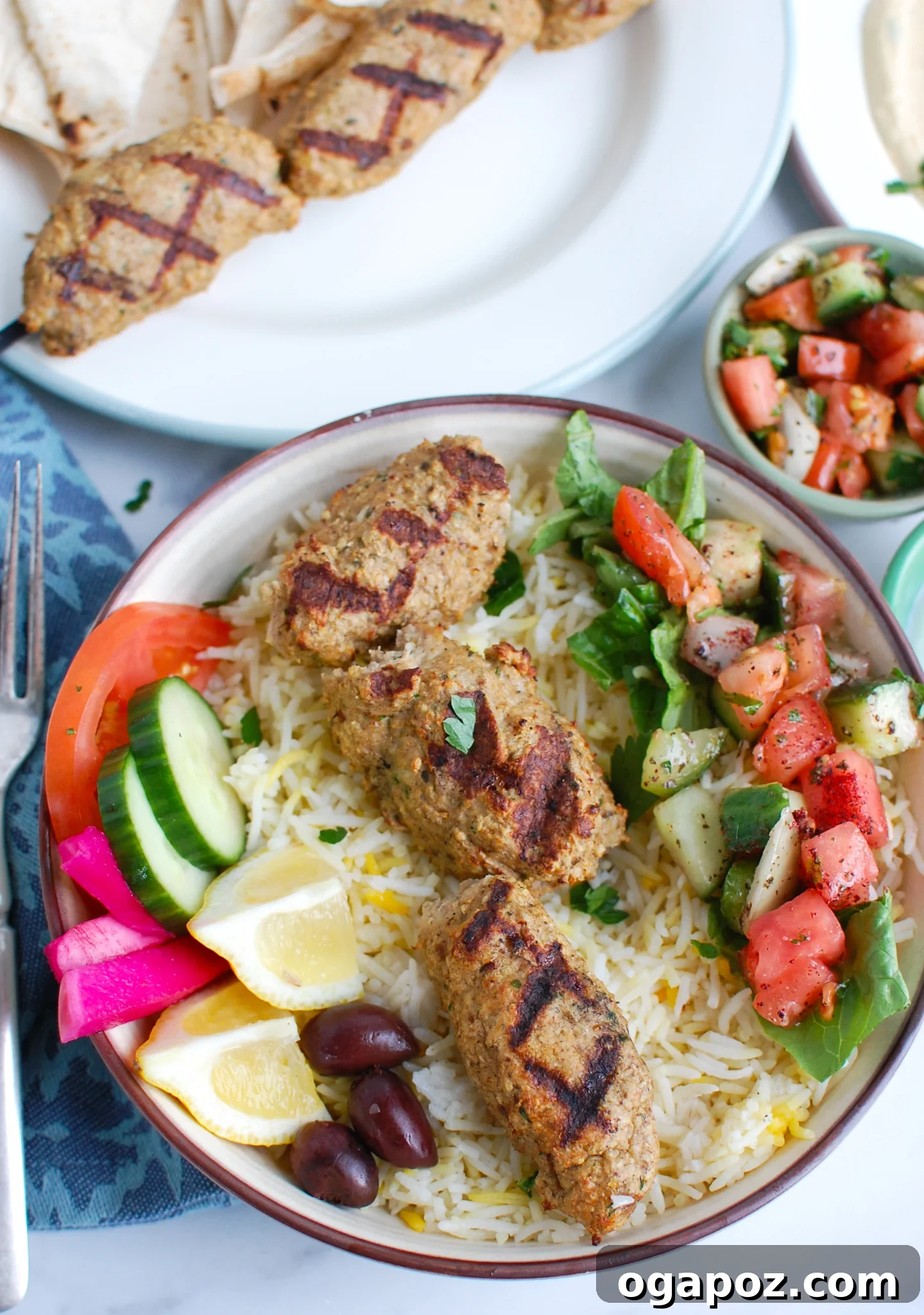Chicken Kofta deliciously arranged in a bowl with rice and garnishes.