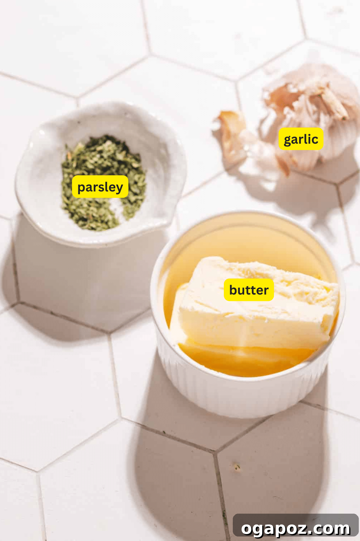 The Easiest 3 Ingredient Garlic Butter Sauce 3 Garlic Butter Sauce Ingredients displayed on a wooden board.