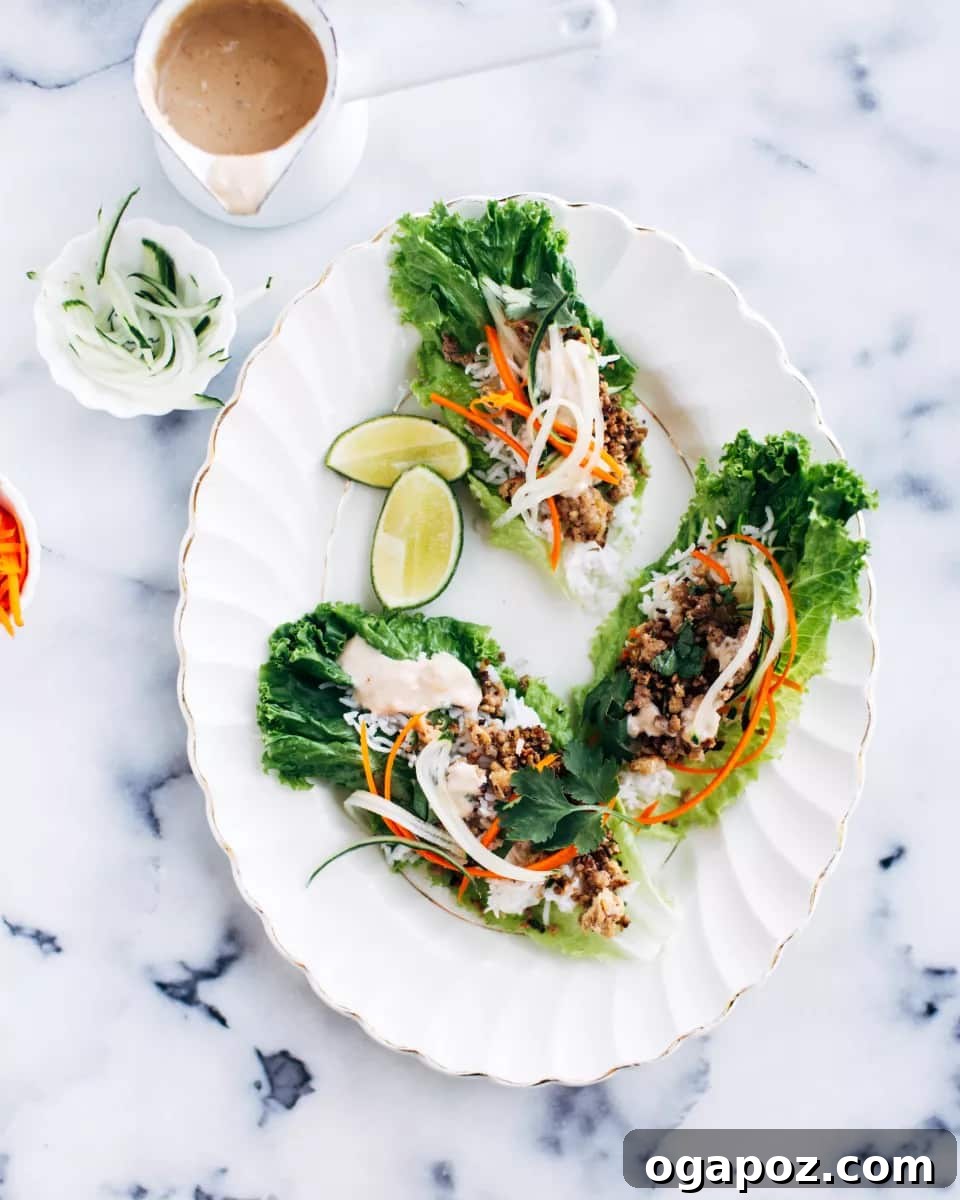 Crispy Pork Lettuce Wraps with Creamy Peanut Sauce 2 Freshly prepared crispy pork lettuce wraps, ready for a delightful summer meal.