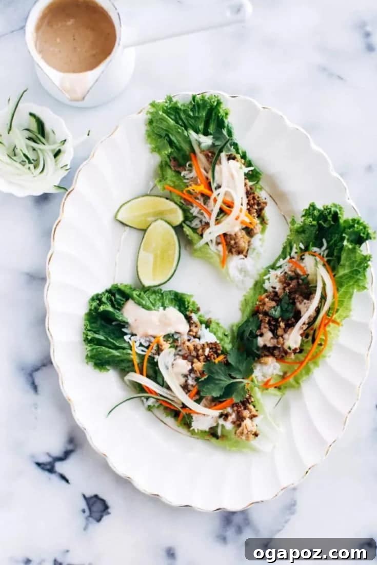 Crispy Pork Lettuce Wraps with Creamy Peanut Sauce 6 A beautifully arranged serving of crispy pork lettuce wraps with all the fresh toppings and peanut sauce.