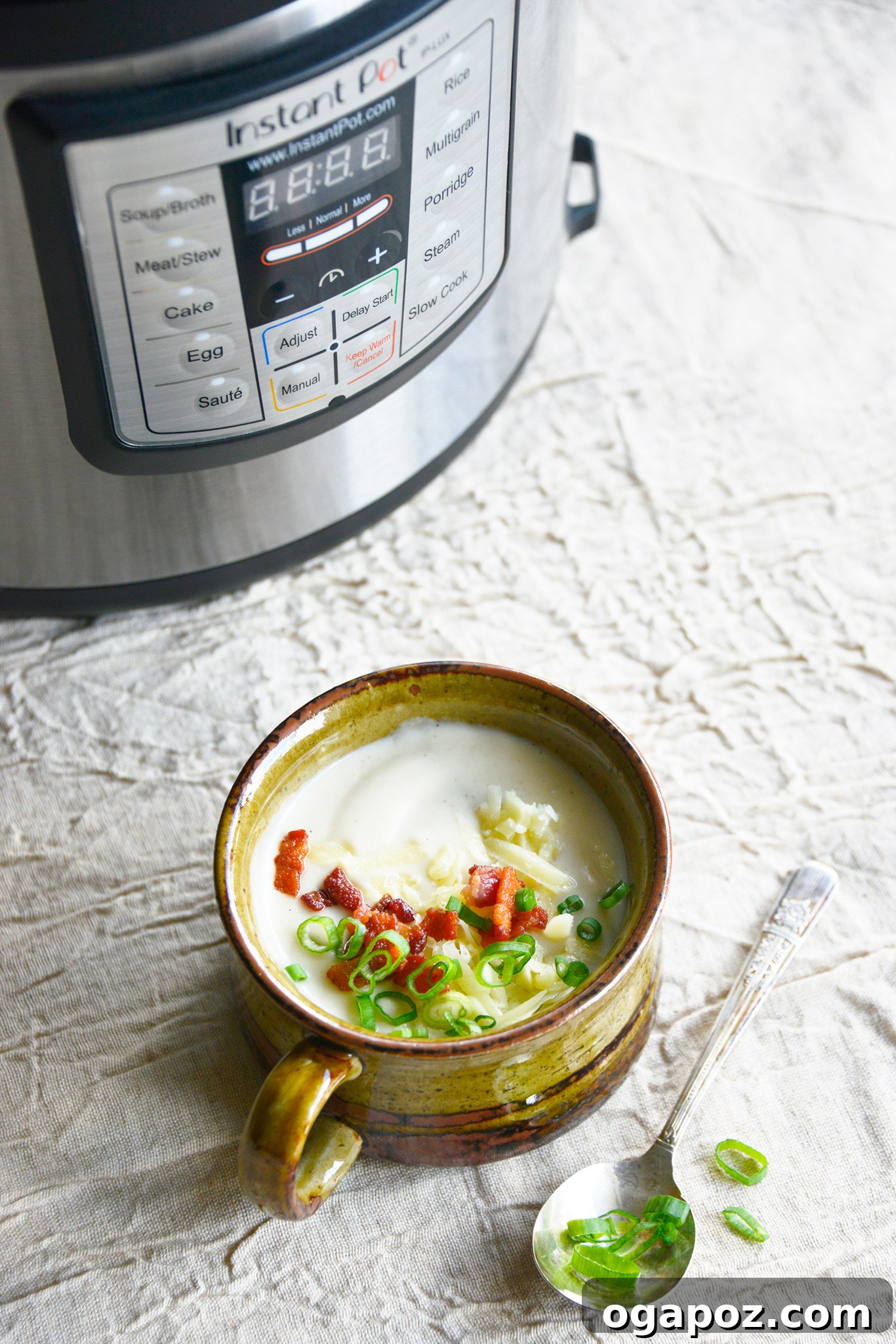 Instant Pot Cauliflower Soup with Instant Pot in background. 