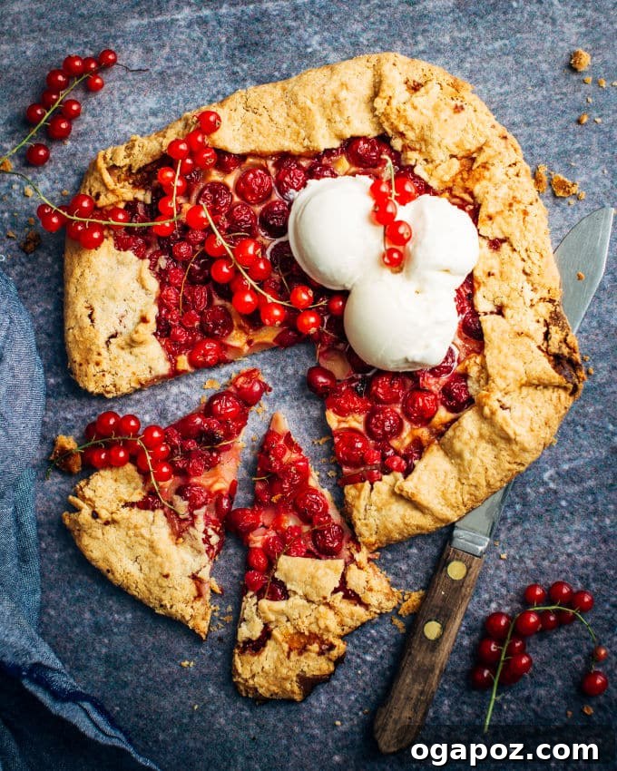 Toasted Almond Cherry Galette 2 A beautifully rustic cherry almond galette, golden brown crust folded over a vibrant red cherry and frangipane filling.