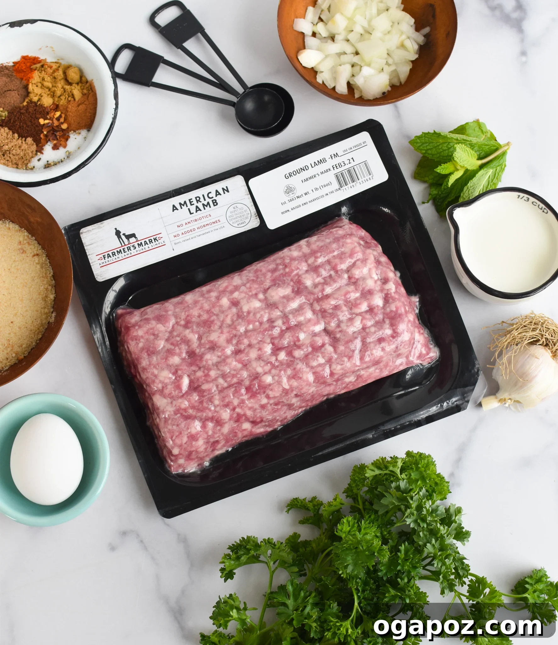 Spiced Lamb Kofta 4 Fresh ingredients for making Lamb Kofta neatly arranged on a rustic wooden table, showcasing the quality of the produce.