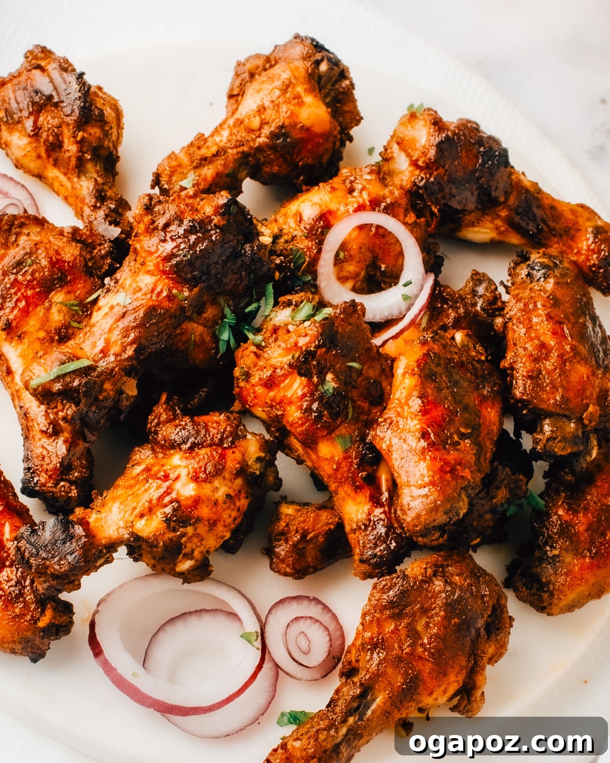 10 Grilling Secrets for Perfect Crispy Chicken Wings 2 Platter of perfectly grilled chicken wings, golden brown and garnished.