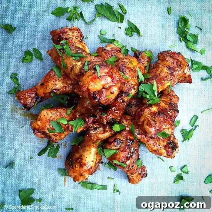 10 Grilling Secrets for Perfect Crispy Chicken Wings 7 Glossy Asian Glazed Chicken Wings garnished with fresh citrus.