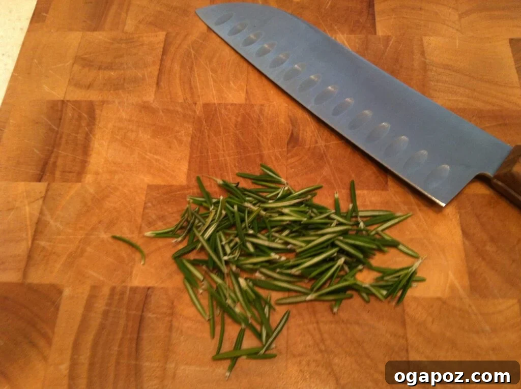 Chopping fresh rosemary Finely chopped fresh rosemary for cranberry spread