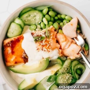 Honey Teriyaki Salmon Bowl with green vegetables and sauce.