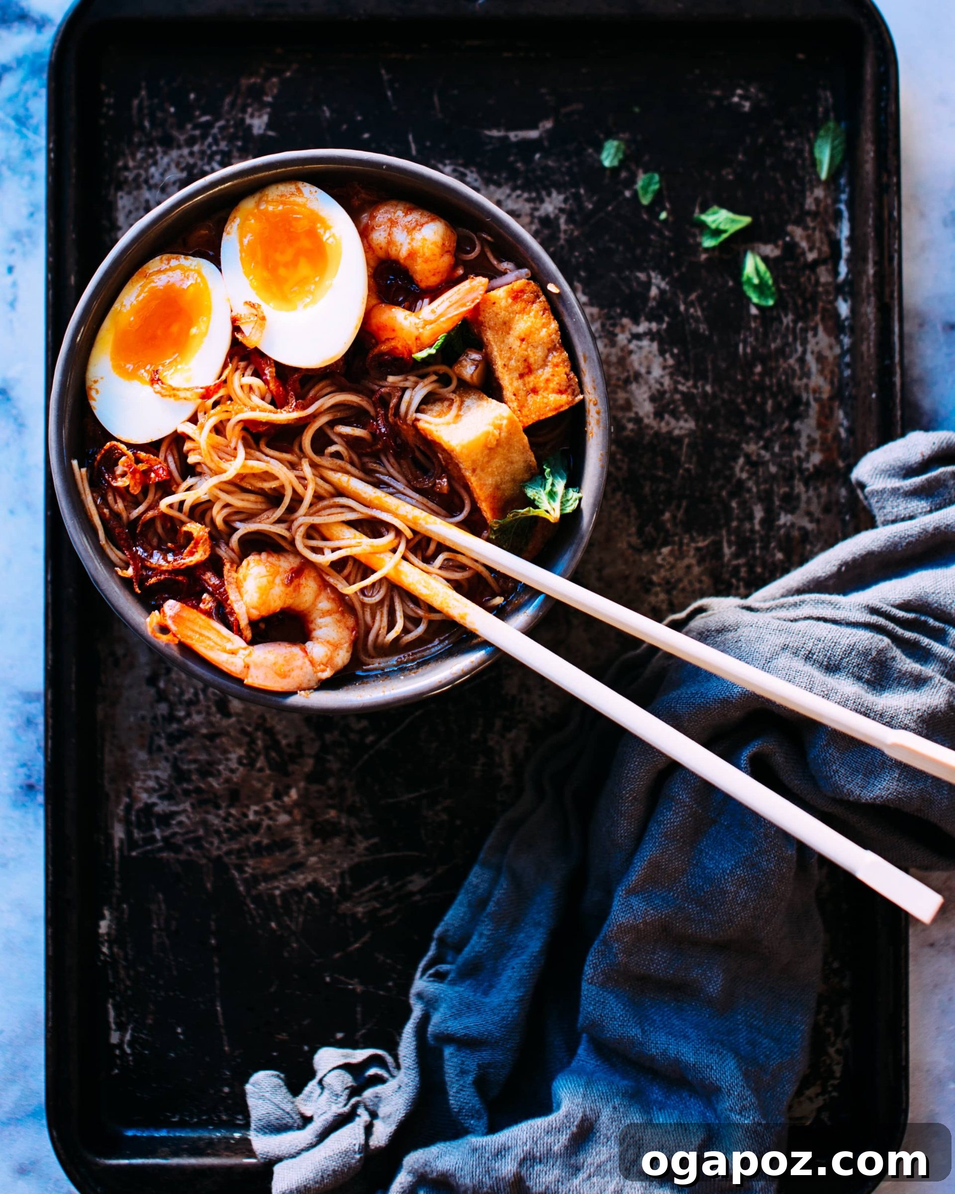 Healthy Shrimp Dinners You'll Crave 5 Exotic Coconut Laksa with Shrimp, garnished with fresh herbs.