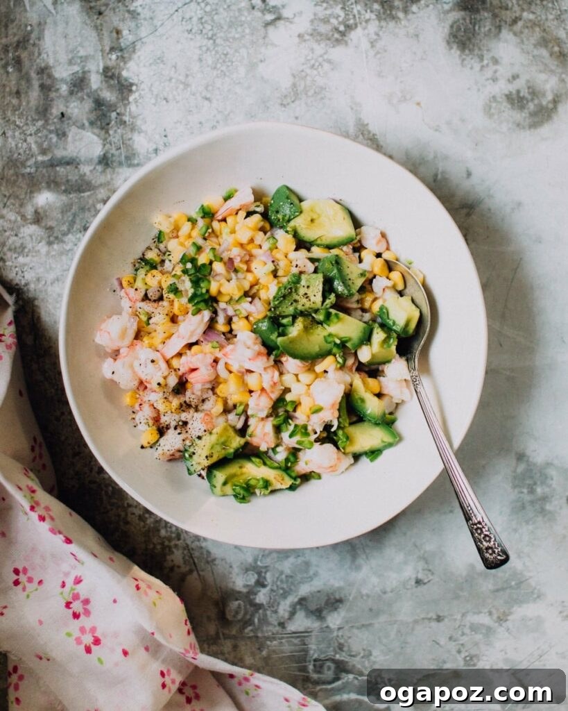 Healthy Shrimp Dinners You'll Crave 8 Fresh Shrimp Ceviche Recipe with Corn and Avocado, ready to be scooped.