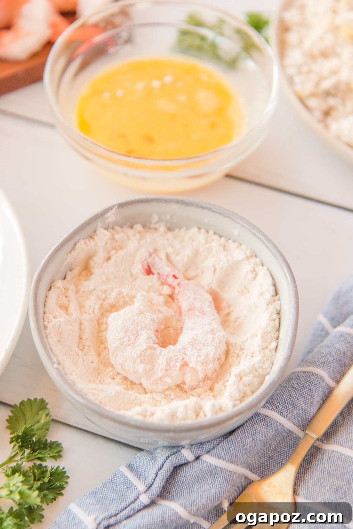 Crispy Air-Fried Coconut Shrimp 6 Air Fryer Coconut Shrimp with the shrimp in the flour.