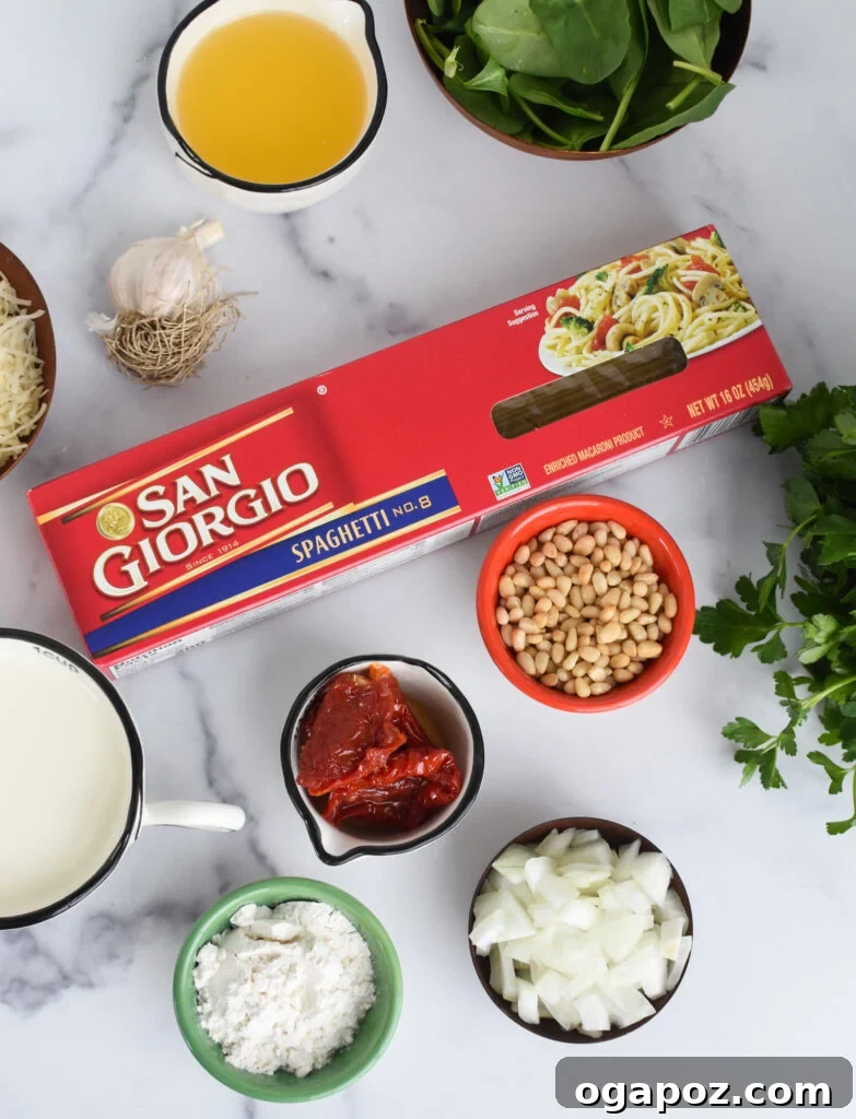 Luscious Creamy Sundried Tomato Pasta 3 All the fresh ingredients for Creamy Sun Dried Tomato Pasta Recipe laid out on a white board.