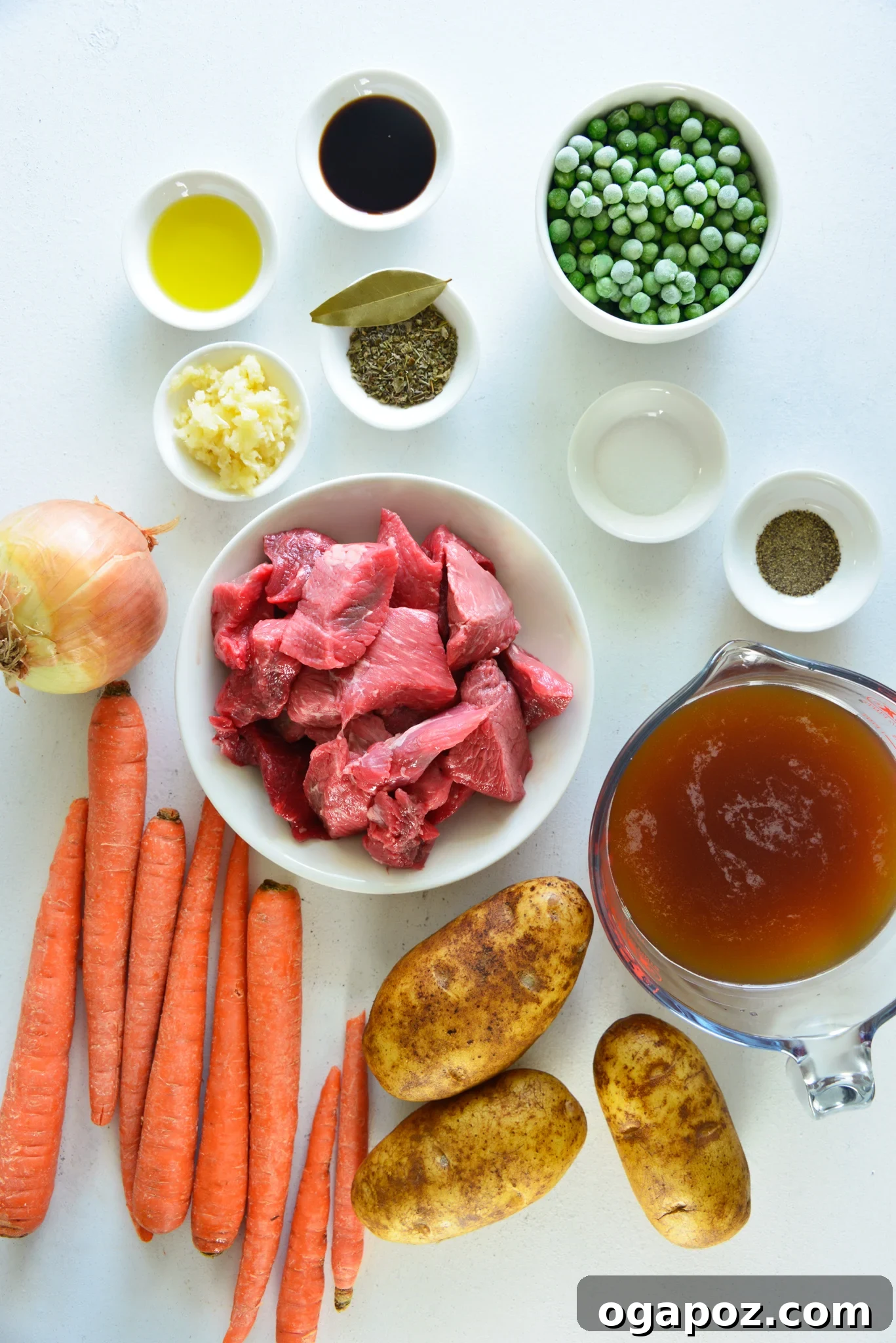 Quick and Tender Instant Pot Beef Stew 3 Instant Pot Beef Stew Recipe ingredients laid out: beef, spices, vegetables, and liquids