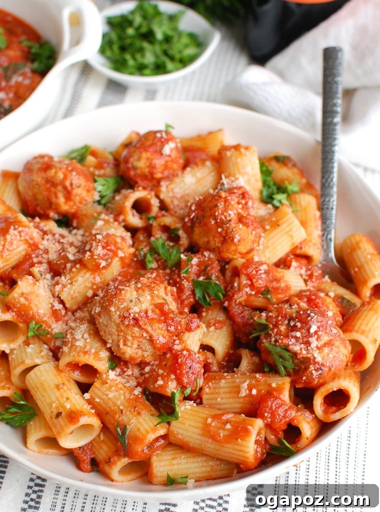 Tender Slow Cooker Turkey Meatballs 4 Crockpot Turkey Meatballs with a serving spoon, showcasing their tender texture