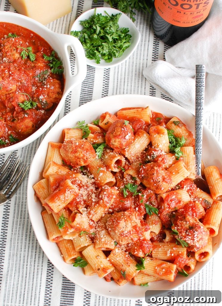 Tender Slow Cooker Turkey Meatballs 5 Overhead shot of Crockpot Turkey Meatballs in a slow cooker, bubbling in sauce