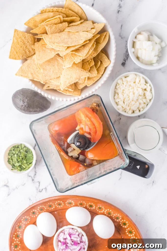 Authentic Mexican Chilaquiles Rojos 5 The blended red sauce for Chilaquiles Rojos in a blender jar, showing its smooth, rich consistency.