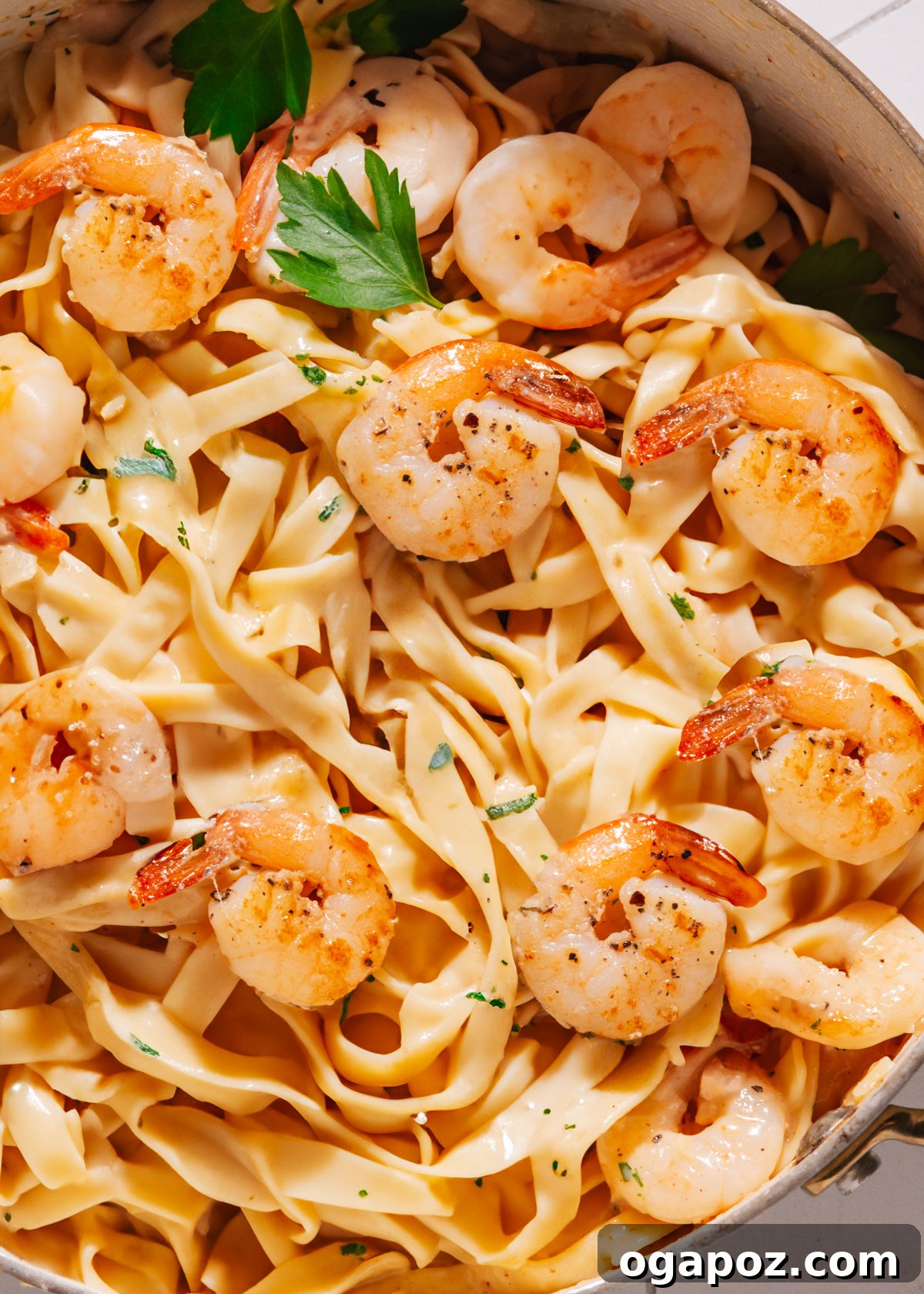Zesty Lemon Cream Shrimp Pasta 7 A bowl of creamy lemon garlic shrimp pasta, garnished with fresh herbs, ready to be served.